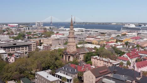 low push-in aerial shot of saint philip's church in the historic french quarter of charleston, south carolina