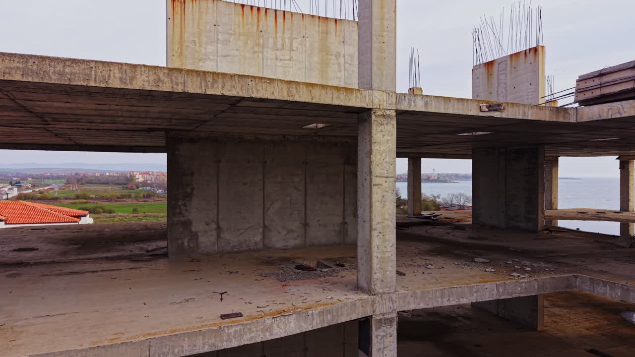 Waterfront construction site with unfinished building elements