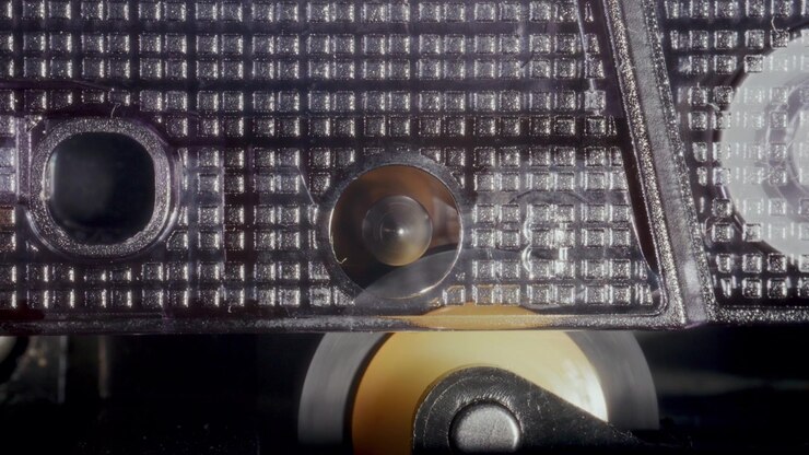 Macro of Retro Audio Cassette Tape Pinch Roller and Capstan Spinning