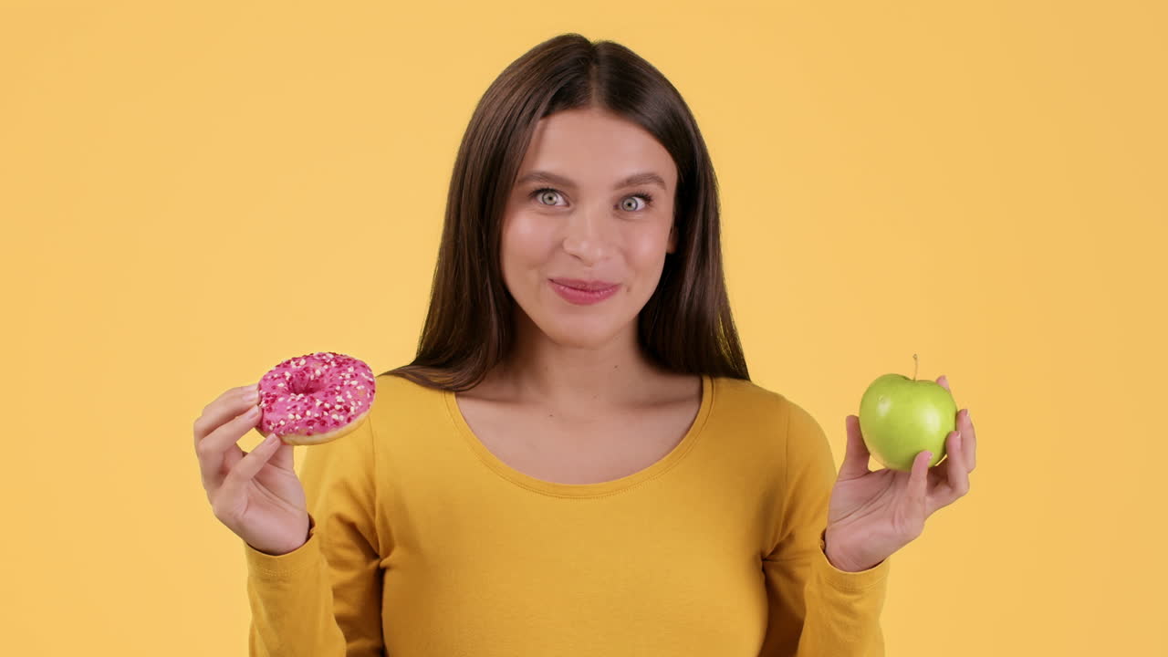 Woman Choosing Between Donut and Apple