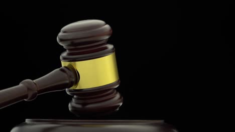 wooden gavel on black background