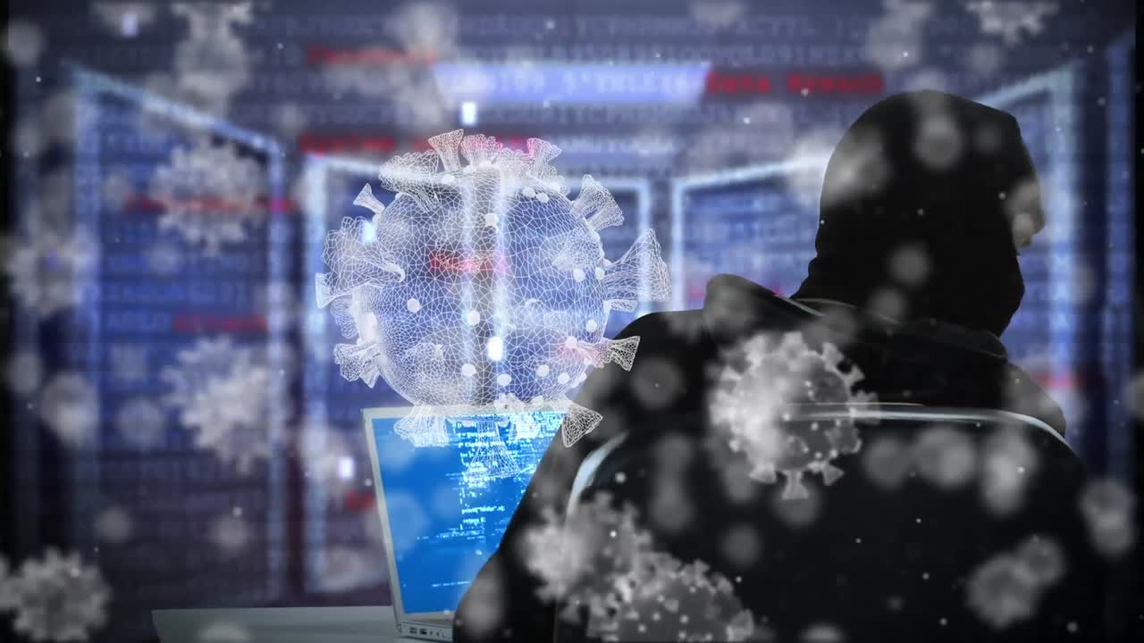 노트북을 사용하여 발라클라바를 입은 남성에 대한 거대한 코로나19 세포의 애니메이션