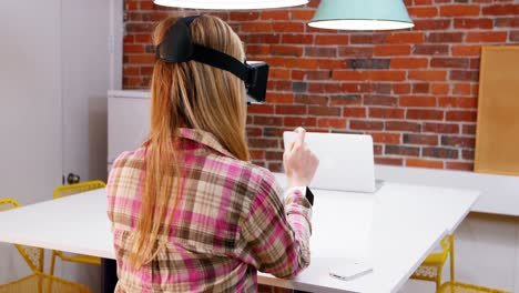 female executive using virtual reality headset