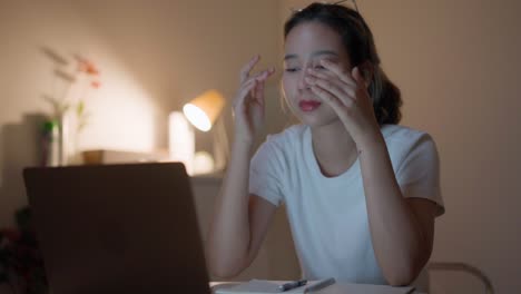 woman use laptops to work at home late during lockdown and are tired.