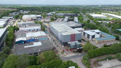 high angle drone flight over warehouse district and tech centres in rural uk setting
