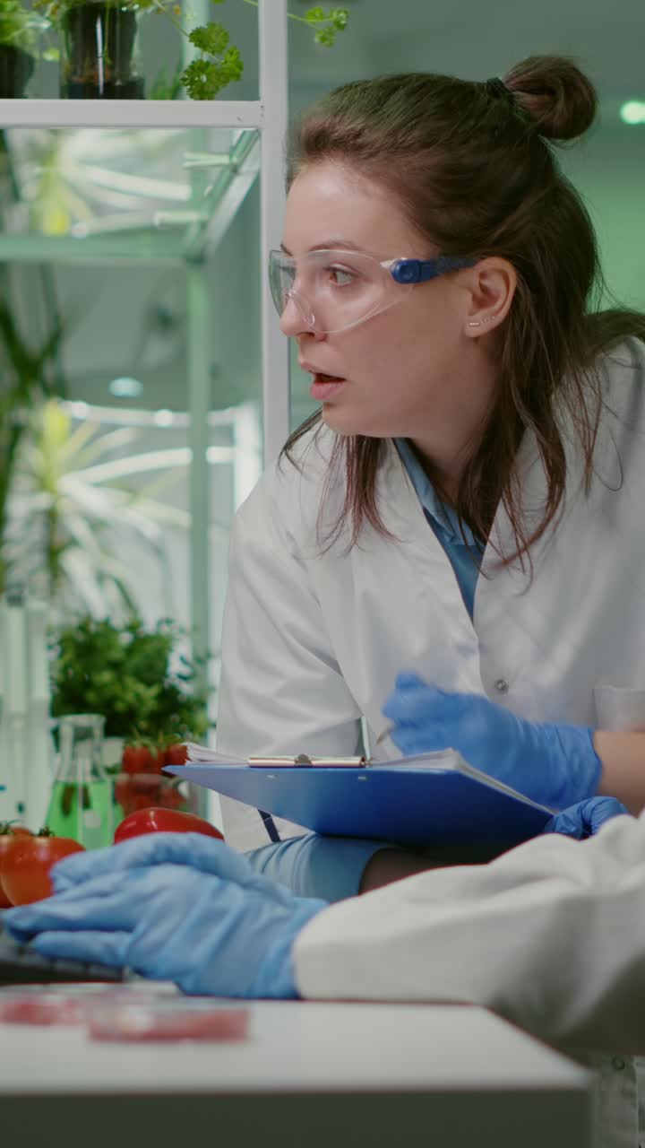 Scientists Conducting Research on Vegetables and Plants in a Biotechnology Laboratory