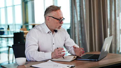 man held his breath looking at the screen of laptop. businessman received surprising news, information that he can't understand.