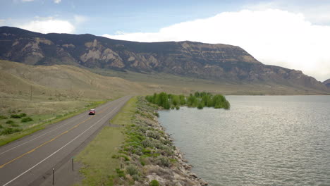 scenic road trip alongside a mountain lake