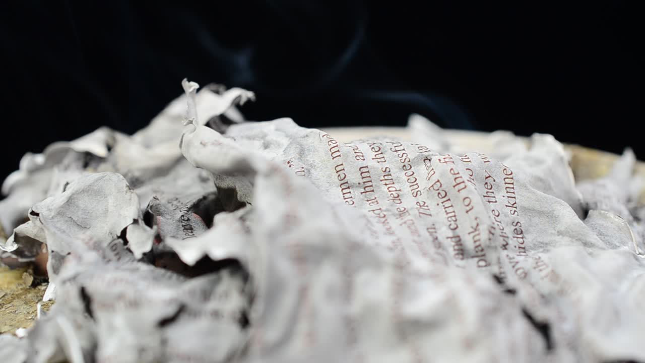 The burning text. The text on paper on fire