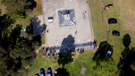 drone aerial pan bird's-eye shot of narara skatepark with bmx and skateboarders wyoming oval gosford central coast nsw australia 3840x2160 4k