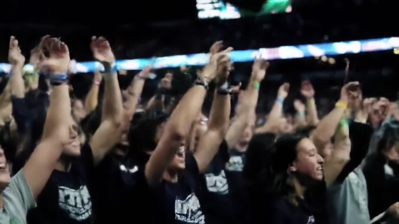 Excitement Fills the Arena as Fans Cheer Passionately During a Thrilling Sports Event