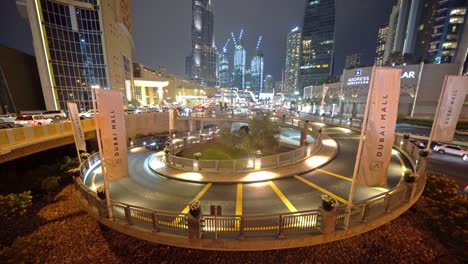 structure of spiral circle ramp or road path way in dubai downtown skyline, united arab emirates or uae. financial district and business area in smart urban city. skyscraper buildings at night.