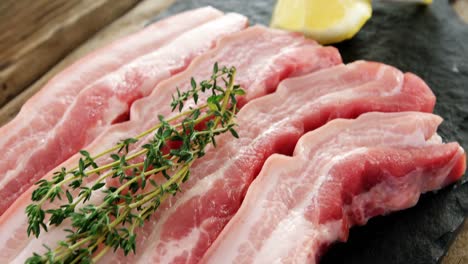 raw meat strips garnished with rosemary