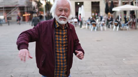 asian senior man dancing outdoor