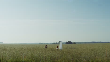 people in a wheat field