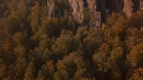 revealing foward shot of the rock formation battert above the spa town of baden-baden in autum at golden hour