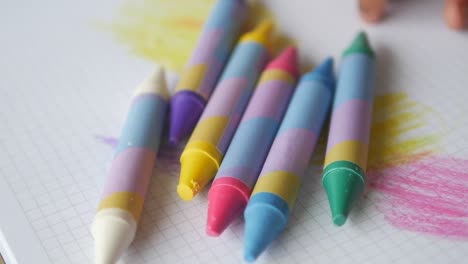 child playing with crayons