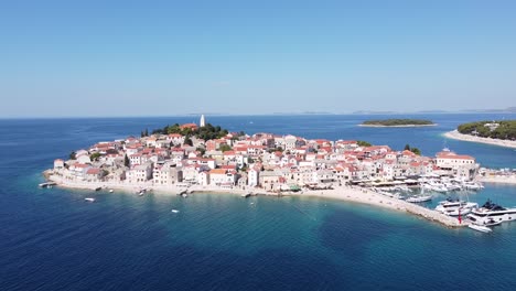 primosten, dalmatia, croatia - aerial drone view of peninsula, old town, port, beach and boats