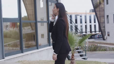 Businesswoman-walking-through-an-office-complex