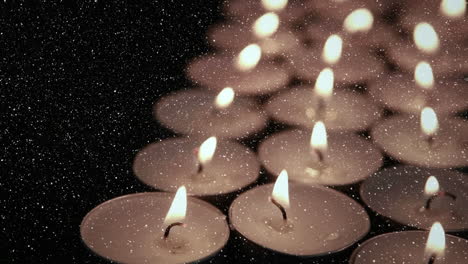 Video composition with snow over tealights