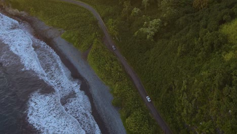 Birds-eye-view-of-the-Hawaiian-island-Maui's-coastal-road-during-sunset