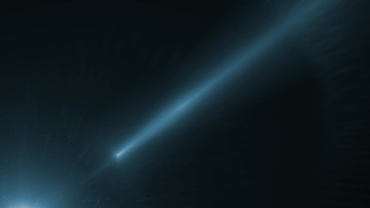 A bright blue light beam or comet streaks across the screen with a glowing tail. For sci-fi, space, or abstract visual effects