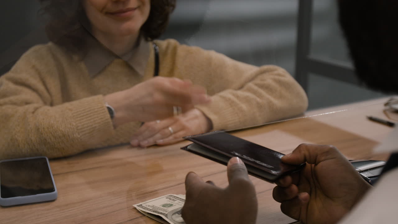 Transaction at a Business with Protective Barrier