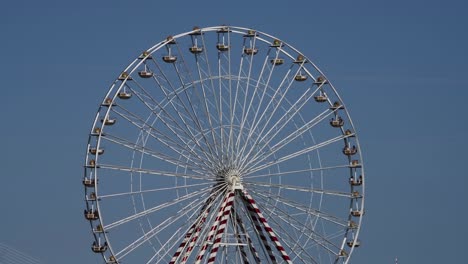 giant ferris wheel with clear blue sky, honfleur, normandy, france