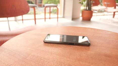woman using smartphone in a cafe