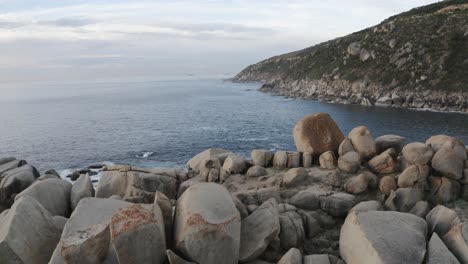 People-Stood-On-Large-Rock-Formation