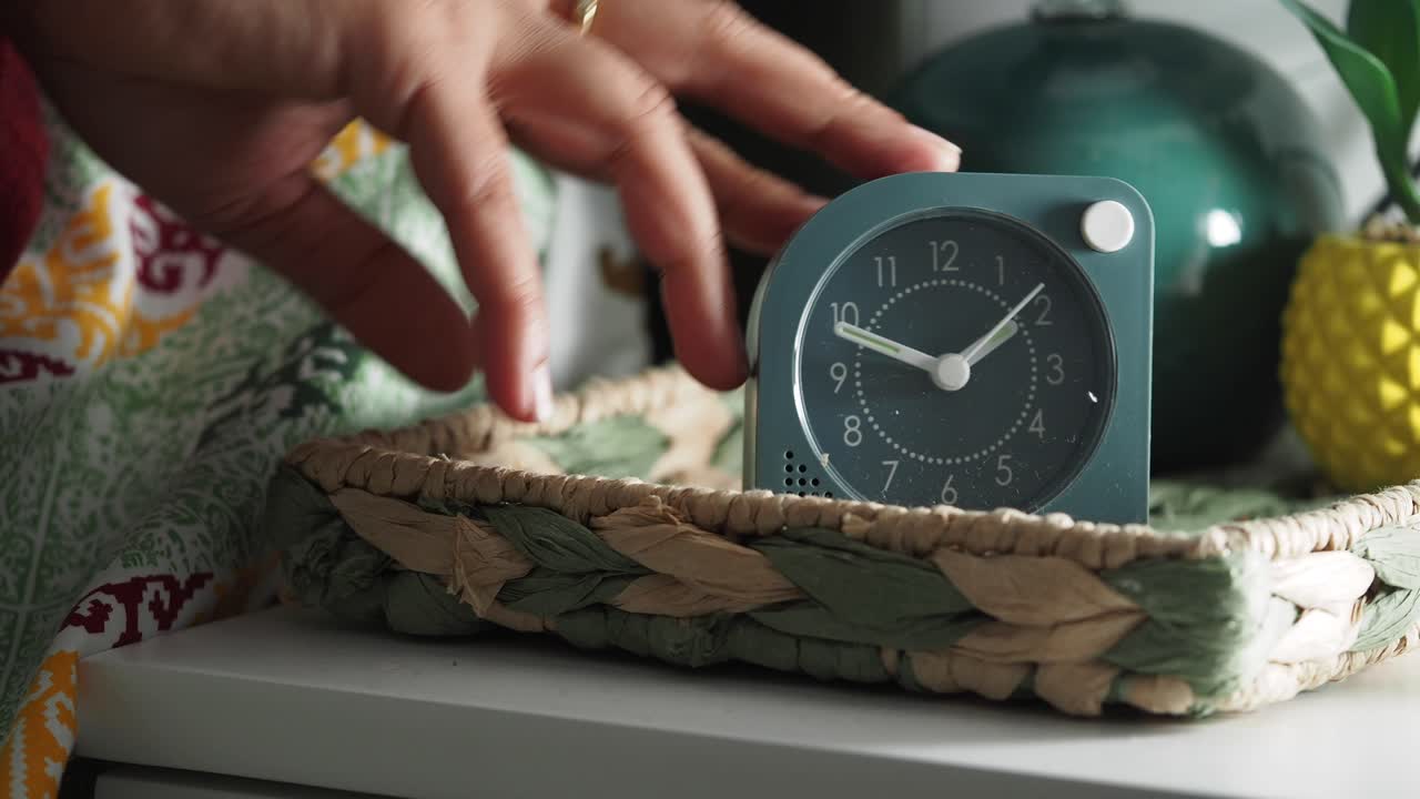 Alarm clock on a bedside table