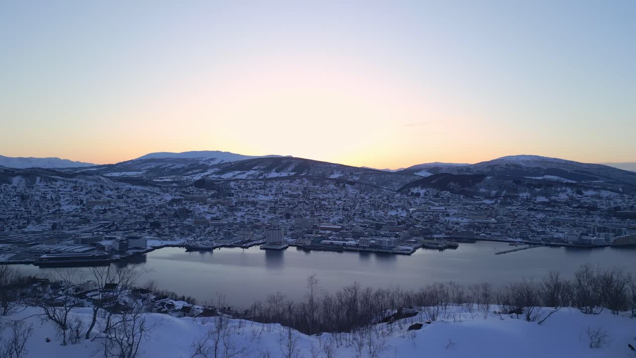 Beautiful Sunset Over a Snow-Covered City in Norway