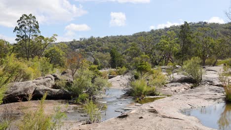 scenic view of a creek flowing through rocks