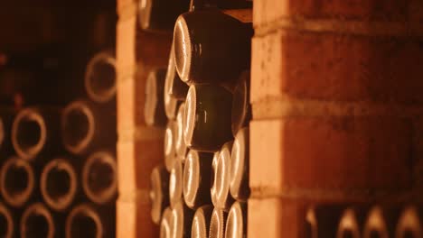 cinematic tilt-up shot of wine collection in old cellar on wine-farm