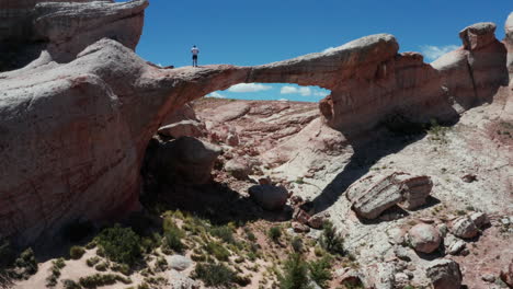 Aerial---Puente-del-Diablo-natural-rock-bridge,-Argentina,-wide-forward-shot