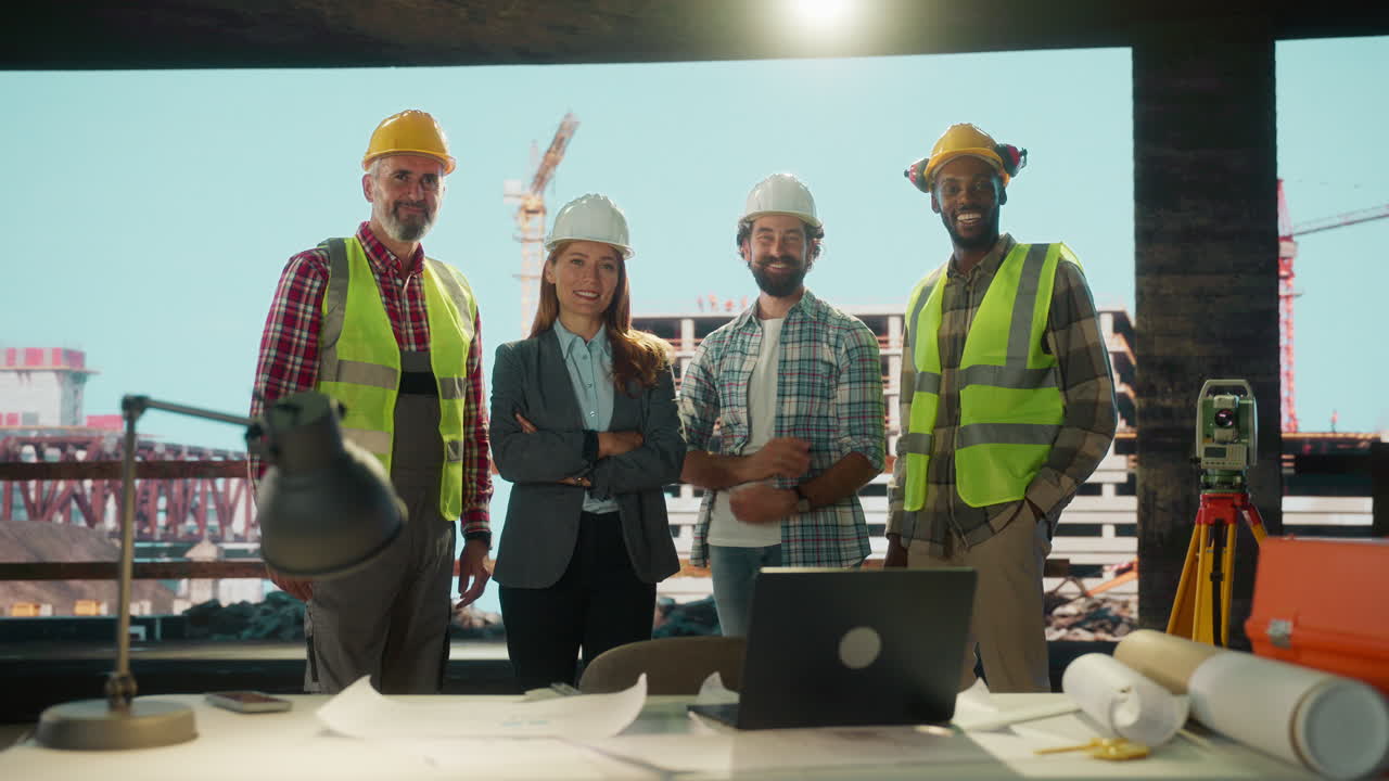 Diverse team of construction and engineering professionals at a building site