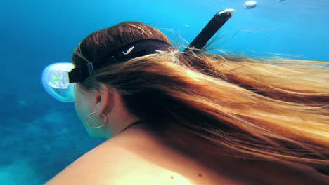 woman snorkeling underwater