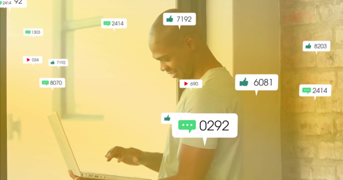 Young Man Using Laptop with Social Media Engagement Notifications