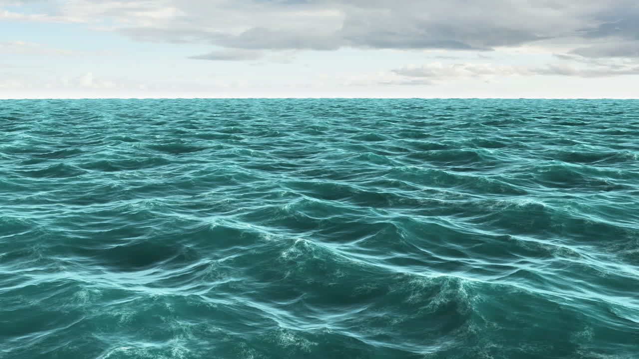 Choppy blue ocean under cloudy sky 