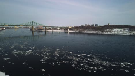 a revealing drone shot of the montreal old-port clock and the canada flag