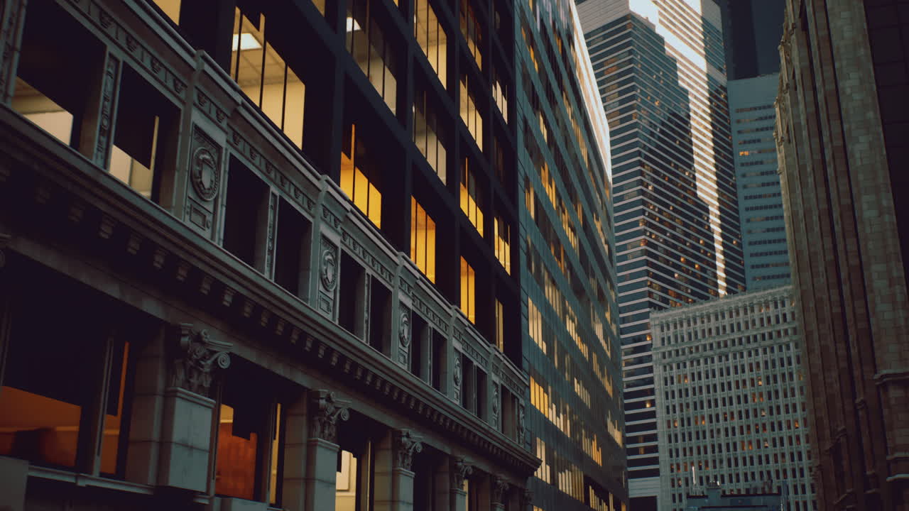 Urban buildings reflecting sunset light in a bustling city landscape