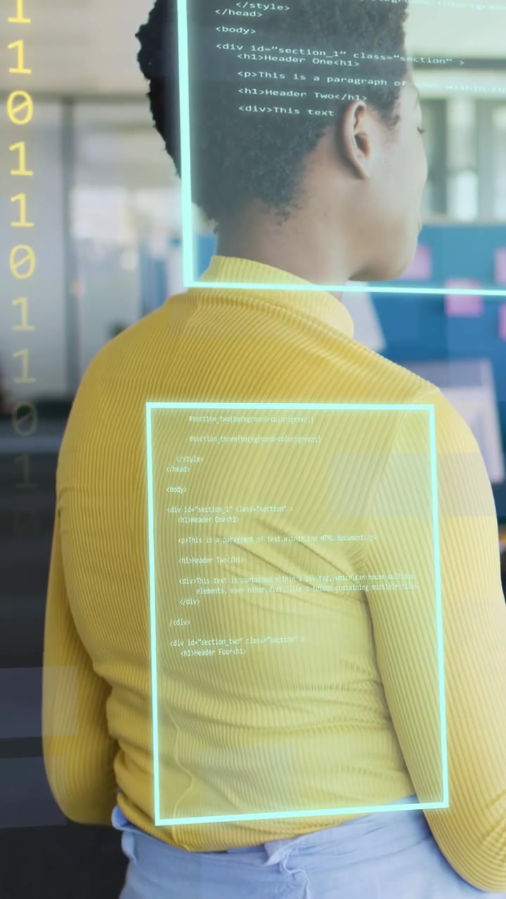 Vertical video: Woman turning right at desk, tech system activating holo UI overlays, responding