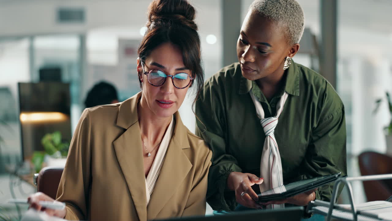 Businesswomen collaborating in a modern office