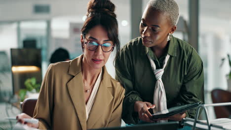 businesswomen collaborating in a modern office