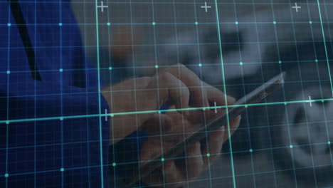 using tablet with digital grid overlay, representing technology and connectivity