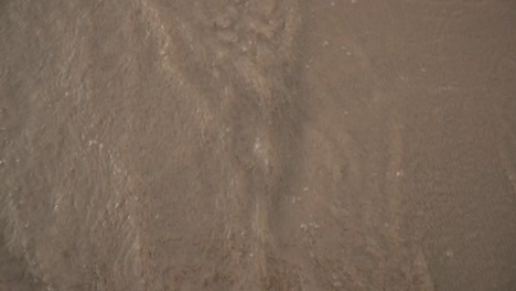 sea waves washing foot print