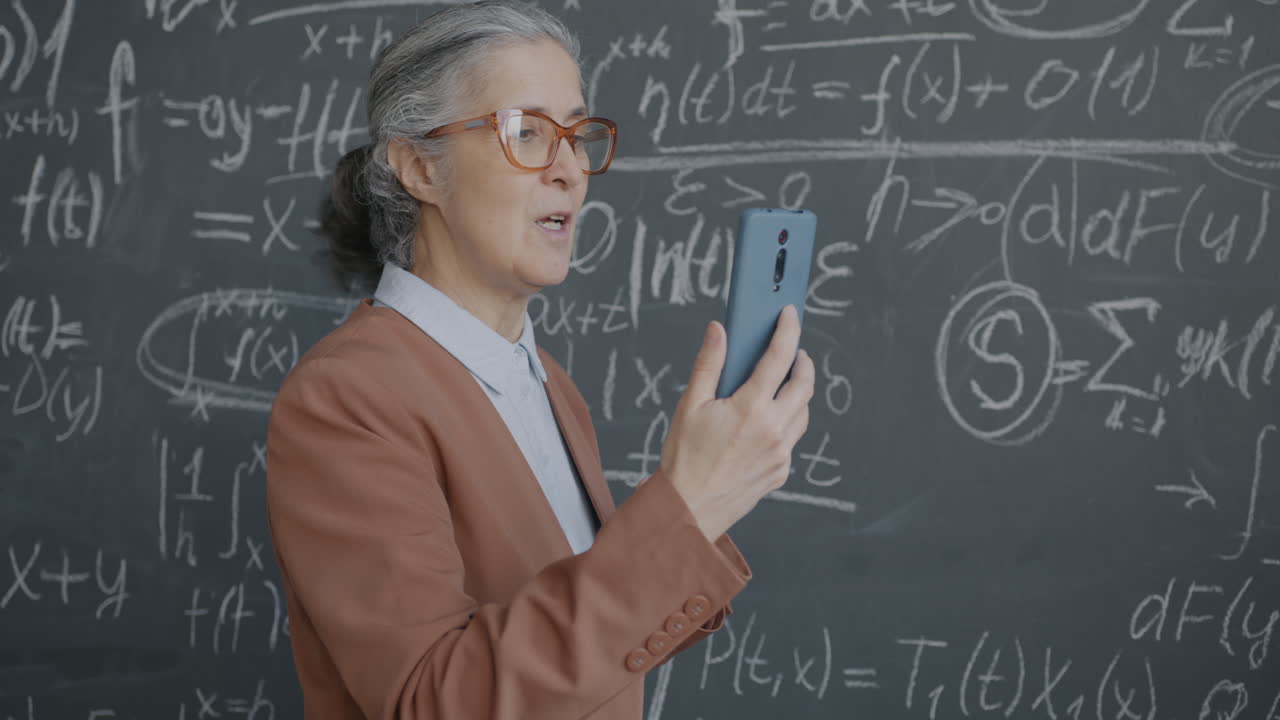 Teacher Using Smartphone in Classroom