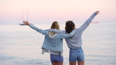 A-woman-taking-photos-of-her-friend-jumping