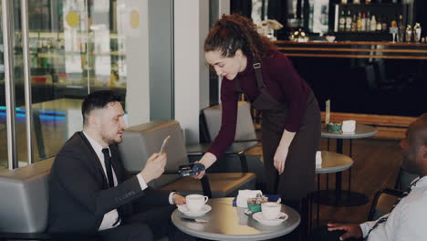 businessmen having coffee in a modern cafe