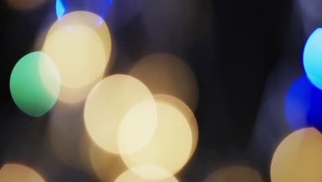 video de puntos de luz bokeh multicolores parpadeantes con espacio para copiar